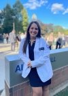 Robin Moscovitch poses in White Coat