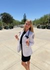 Lily Cohen posing in her white coat