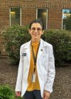 Sarwat Latif, physician assistant studies student, in white coat at the Midwestern University Downers Grove Campus.