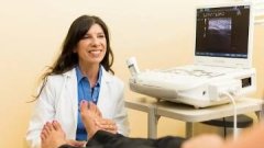 teacher examining patient's feet