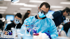 student with dental mannequin