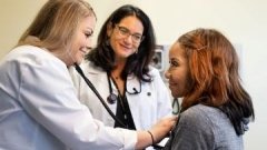 doctor checking patient with stethoscope