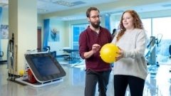 physical therapy patient doing exercise with therapist