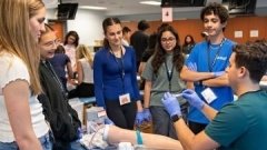 high school students being taught in a clinical setting
