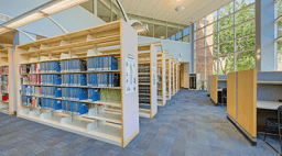 Library shelves and seating at Sahuaro Hall.