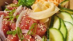 Closeup of a poke bowl with veggies