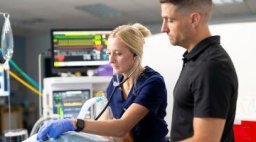 Nurse anesthesia student with professor in lab