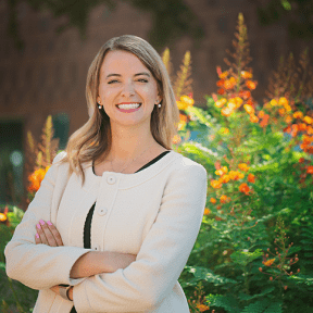 Doctor posing in campus gardens