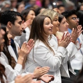 Students clapping in the audience