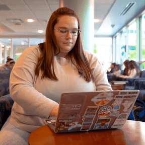 Alyssa Bowen works on her laptop.