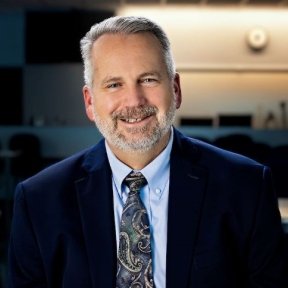 Del Eckman sits in a classroom at Midwestern University.