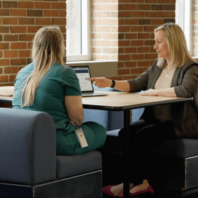 Kolla Kristjansdottir meets with a student at Midwestern University.