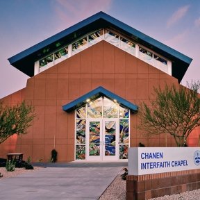 Exterior view showing doors and windows with stained glass.