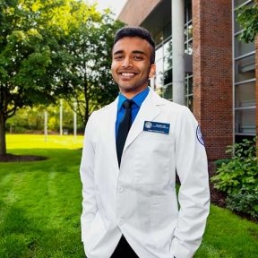 Sumith Liju wearing his white coat.