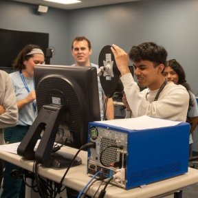 High school students in the Midwestern University optometry simulation lab.