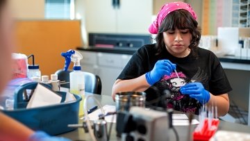 High school student in lab.