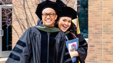 Graduates smiling.