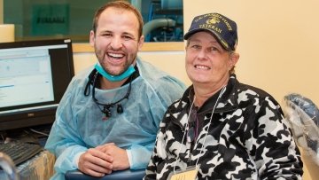 dental provider posing with veteran