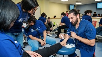 MWU student performing ultrasound on foot