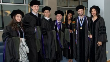 Graduates pose together before the ceremony.