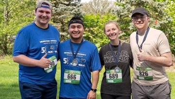 A few of the Groovin' in the Grove race participants pause for a photo together.