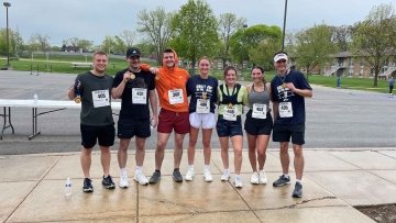 Runners posing for a group photo