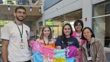 Pharmacy students make no-sew blankets and display their handiwork.