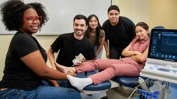 Arizona high school students participating in a hands-on podiatry demonstration at Midwestern University.