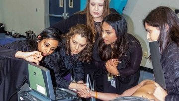 MWU students using ultrasound.