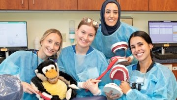 Dental Students pose with animals and props