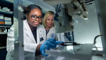 Student and professor in lab