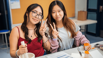 High school students learning hands-on skills at Midwestern University.