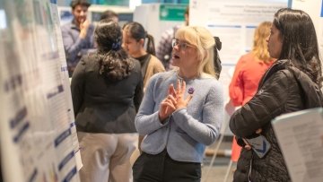 Students present research poster