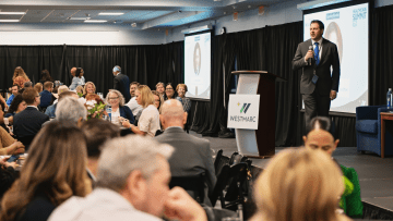Dr. Joshua Baker, President and CEO of Midwestern University, welcomes attendees of the WESTMARC Healthcare Summit '25 held on June 11, 2025.