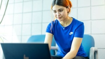 Student sit at computer