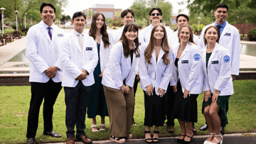 First-year Midwestern University students with their new white coats.