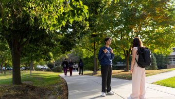 students talking outside on IL campus