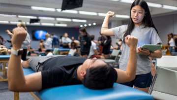 Two students in PT Lab