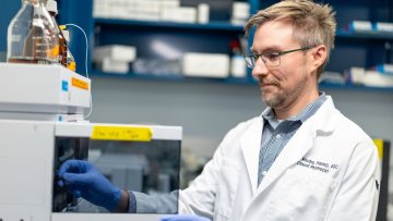 Dr. Rhodes works in lab