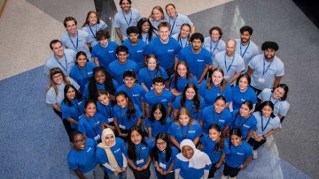 Students in a group posing for picture