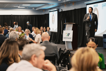 Dr. Joshua Baker, President and CEO of Midwestern University, welcomes attendees of the WESTMARC Healthcare Summit '25 held on June 11, 2025.