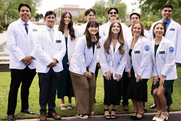 First-year Midwestern University students with their new white coats.