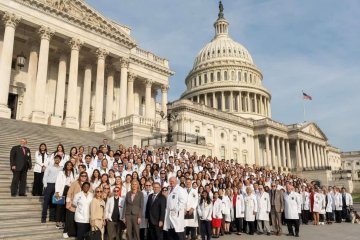 Large group stands on U.S. capitol steps