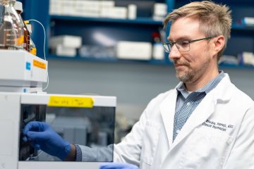 Dr. Rhodes works in lab