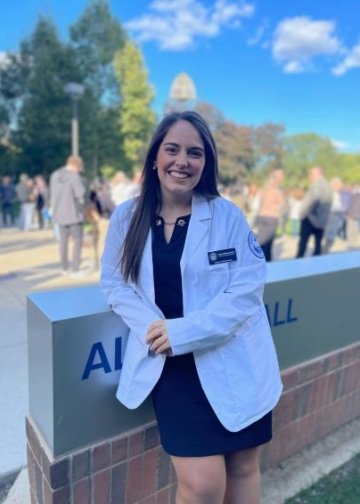 Robin Moscovitch poses in White Coat