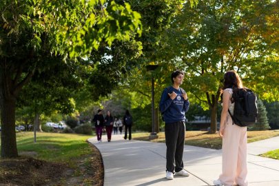 students talking outside on IL campus