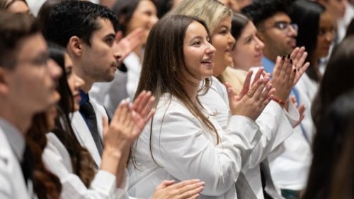 Students clapping in the audience