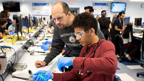 High school student working in the dental lab.