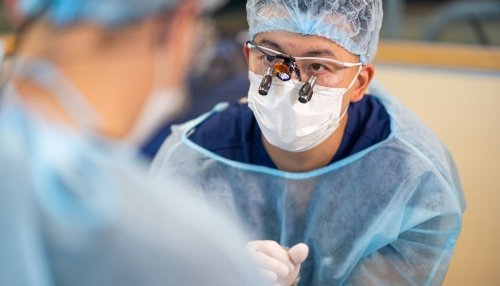 Midwestern University dental student works with an instructor.