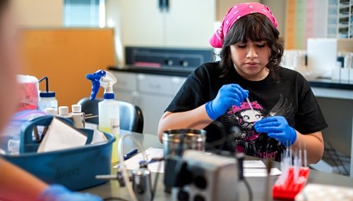 High school student in lab.